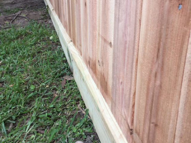 Cedar fence pickets and rot board