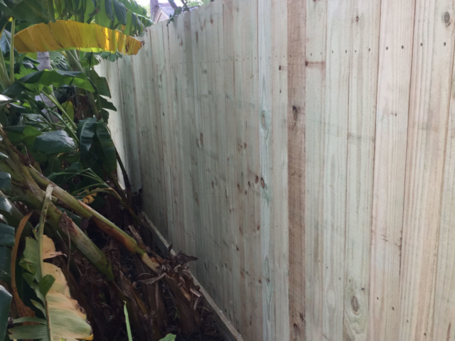 New Wood Pine Fence with three rails and rot board.